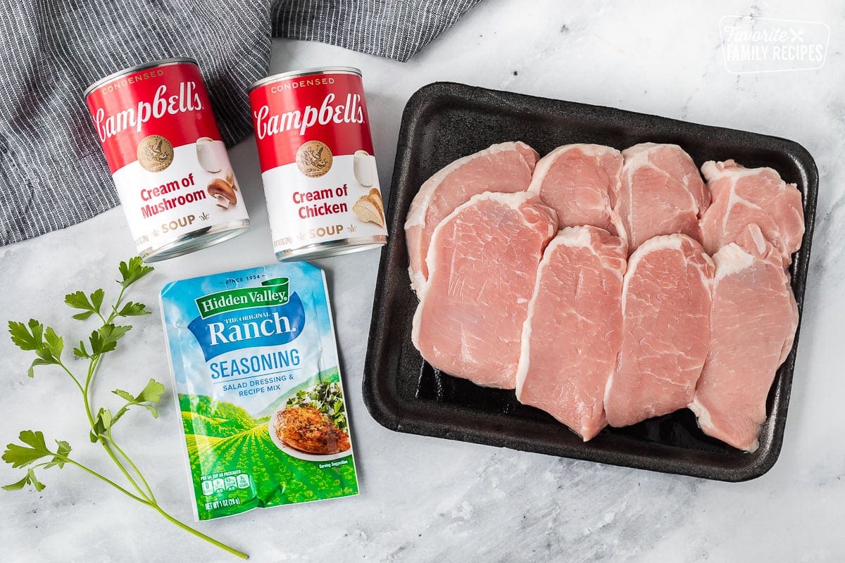 Ingredients to make Crock Pot Pork Chops including pork chops, ranch seasoning, cream of chicken soup and cream of mushroom soup.