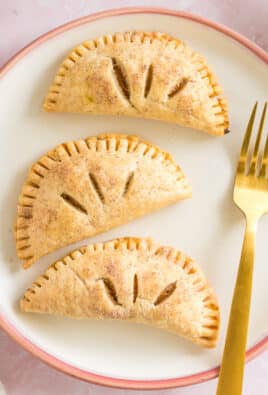 three pumpkin pasties on a plate