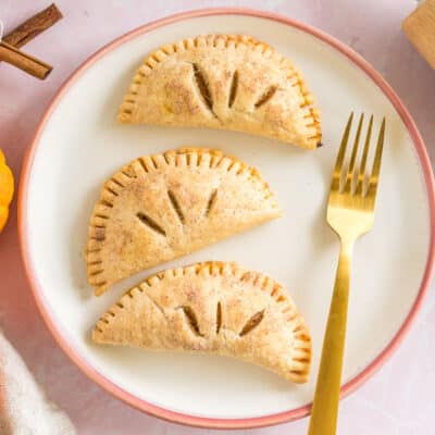 three pumpkin pasties on a plate