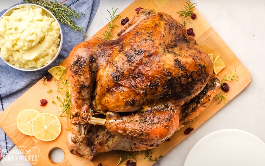 Perfectly cooked Thanksgiving turkey on a cutting board