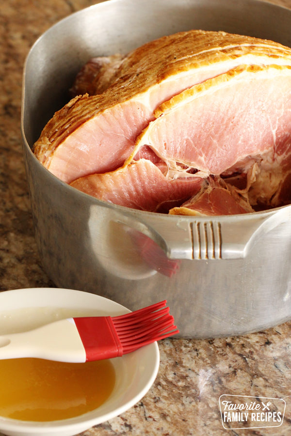 Ham in a roasting pan ready to glaze