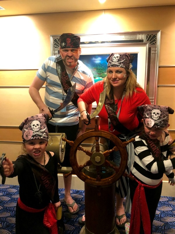 Erica and family in pirate clothes. 
