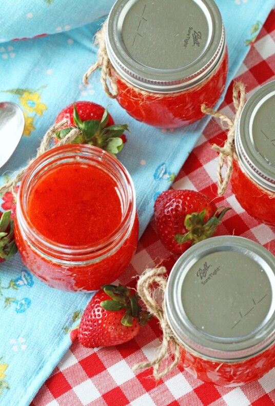 strawberry jam in jars on a tablecloth