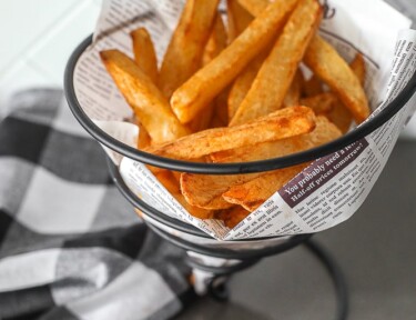 Air Fryer French Fries in a basket with 3 dipping sauces