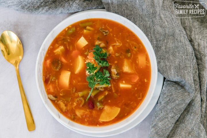 A bowl of Weight loss magic soup with vegetables and parsley