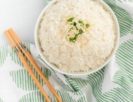 A bowl of rice with chopsticks