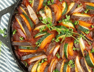 Ratatouille in a black skillet.