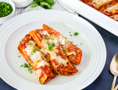 Side view of Cheese Manicotti on a plate.