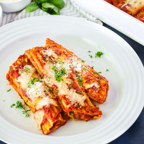 Side view of Cheese Manicotti on a plate.