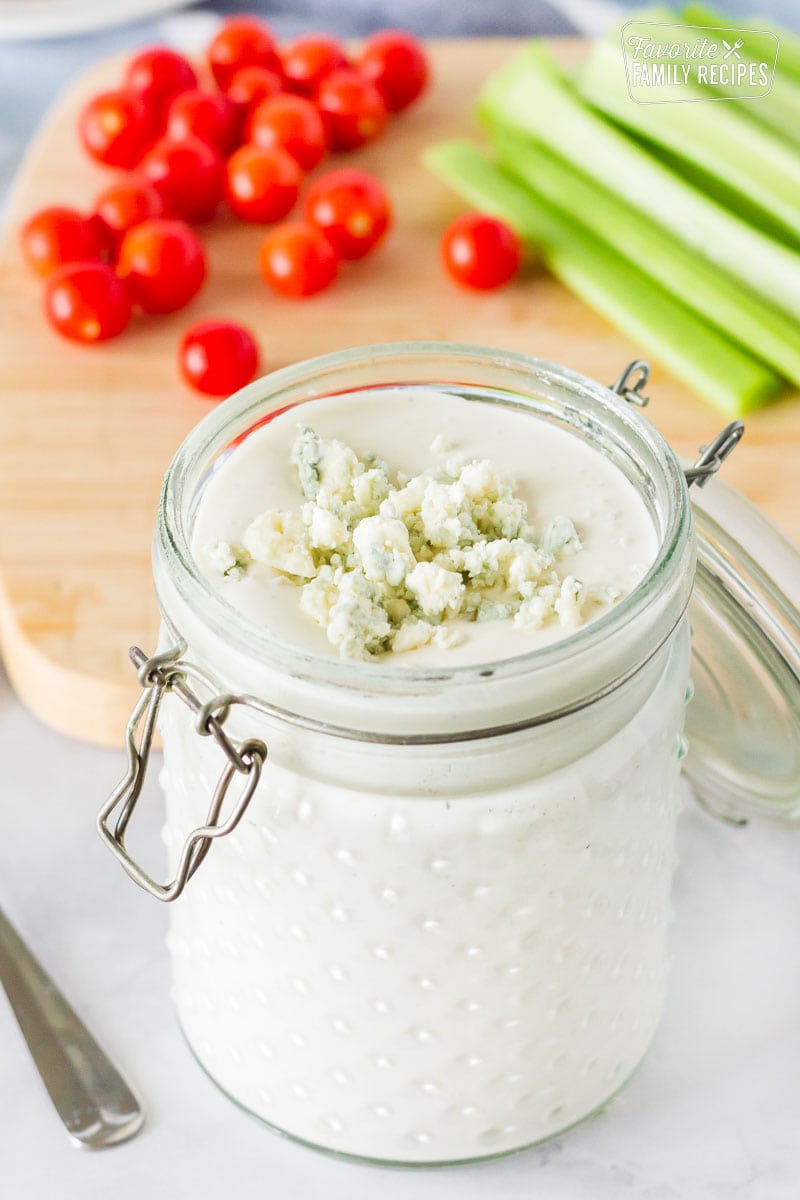 close-up-view-of-blue-cheese-dressing-in-a-jar-topped-with-crumbles