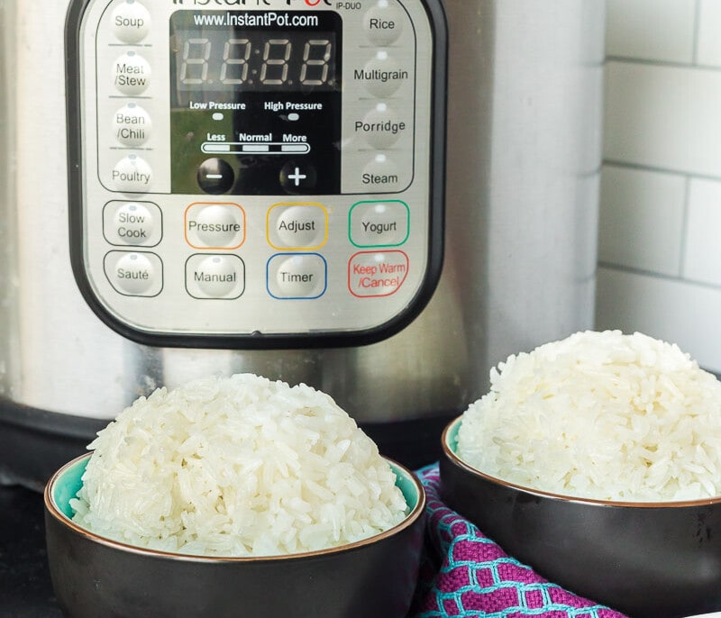 Two bowls of rice in front of an Instant Pot