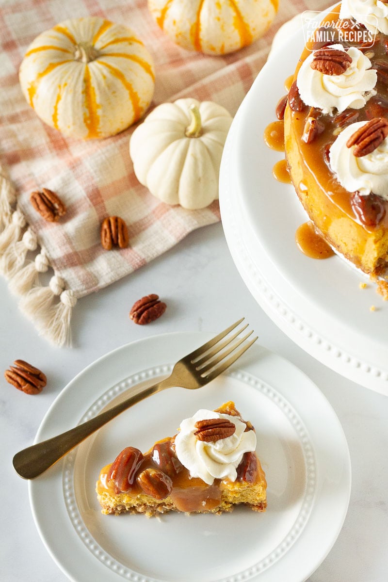 Slice of Pumpkin Cheesecake on a plate with a fork.