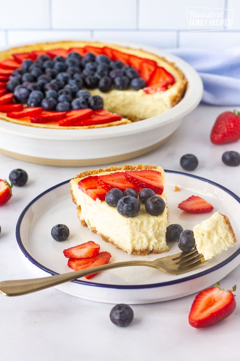 https://www.favfamilyrecipes.com/wp-content/uploads/2022/10/Fork-cut-into-cheesecake-showing-How-to-Make-a-Cheesecake.jpg