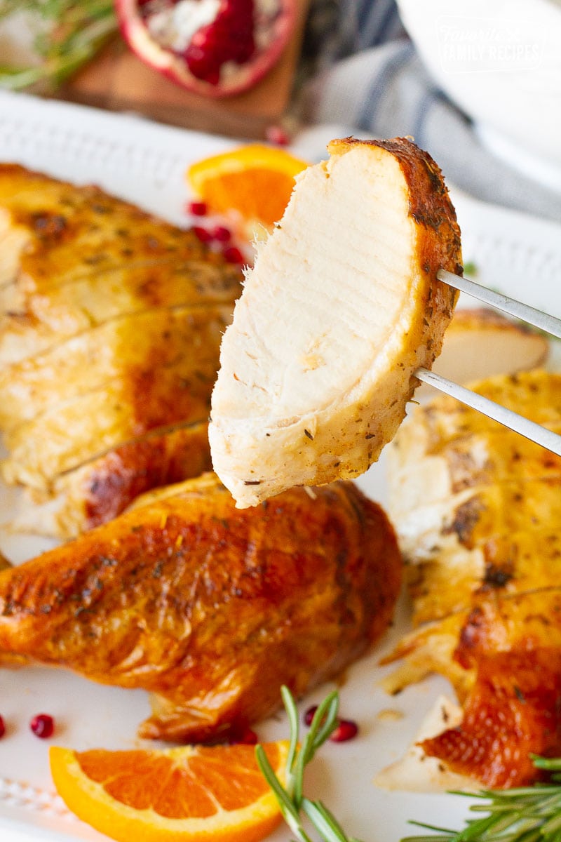 https://www.favfamilyrecipes.com/wp-content/uploads/2022/10/Fork-in-Turkey-breast-for-How-to-Cook-a-Turkey.jpg