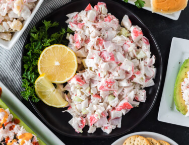 Crab salad on a plate surrounded by other crab recipes.