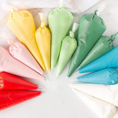 Red, pink, yellow, light green, dark green, blue and white bags of Royal Icing.