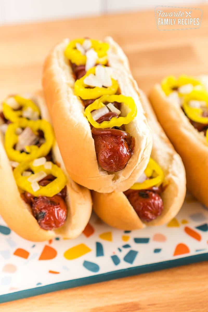 https://www.favfamilyrecipes.com/wp-content/uploads/2023/01/BBQ-Hot-Dogs-stacked.jpg