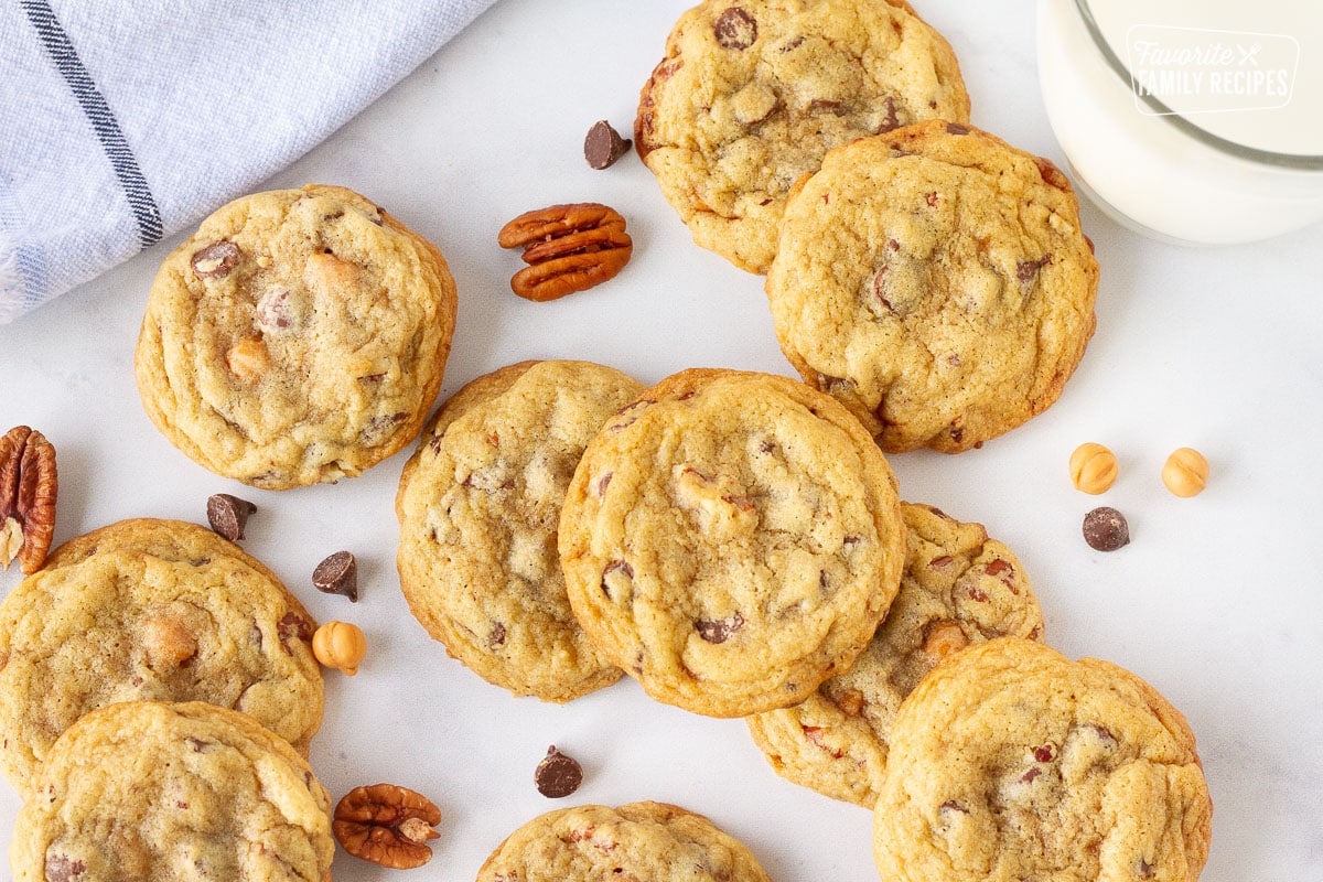 Turtle Cookies on a table with a glass of milk.