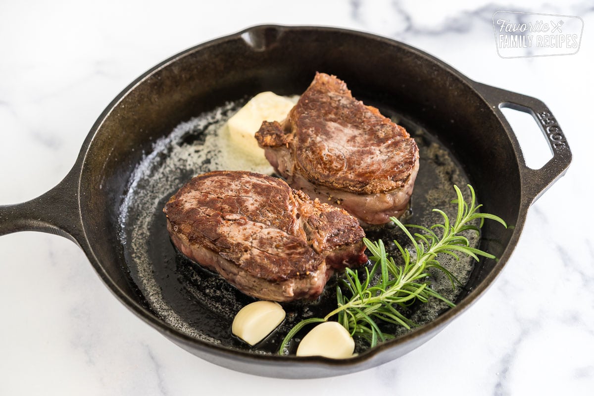 https://www.favfamilyrecipes.com/wp-content/uploads/2023/05/Cast-Iron-Filet-Mignon-with-butter-and-herbs.jpg