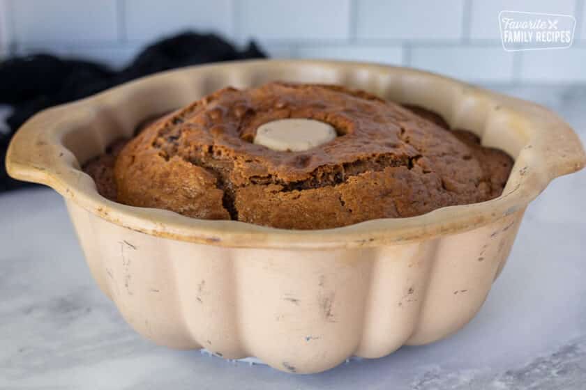 Side view of cooling Spider Cake in bundt pan.