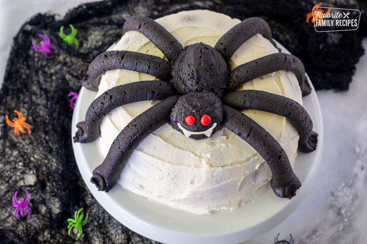 Top view of a frosted spider on a bundt Cake.