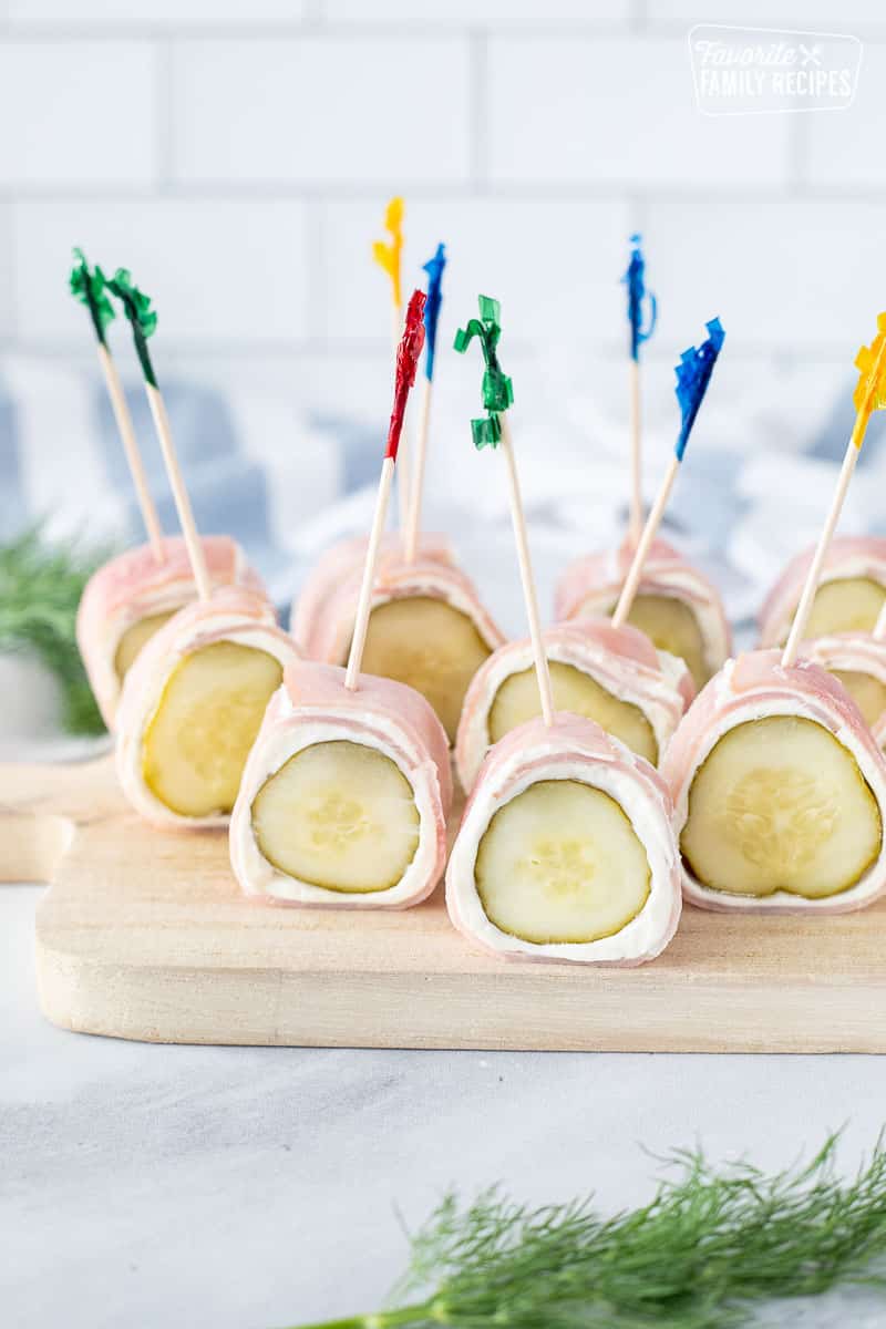 https://www.favfamilyrecipes.com/wp-content/uploads/2023/08/Ham-Roll-Ups-with-Pickle-and-toothpicks.jpg