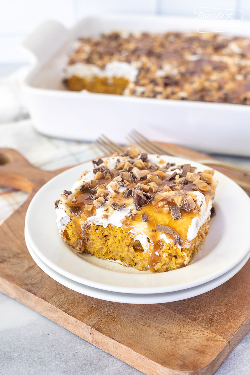 Pumpkin Poke Cake slice on a plate.