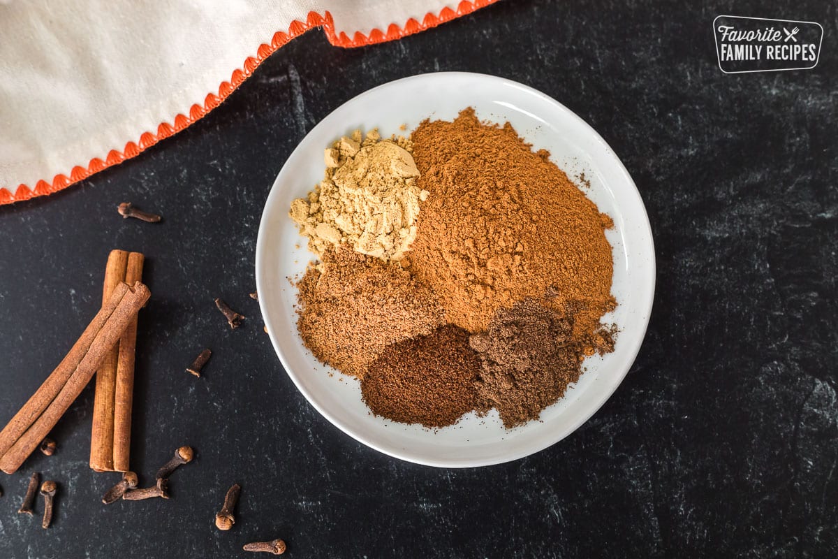 Plate of spices to make Pumpkin Pie Spice Substitute.