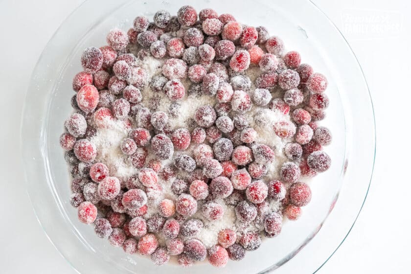 cranberries being rolled in sugar