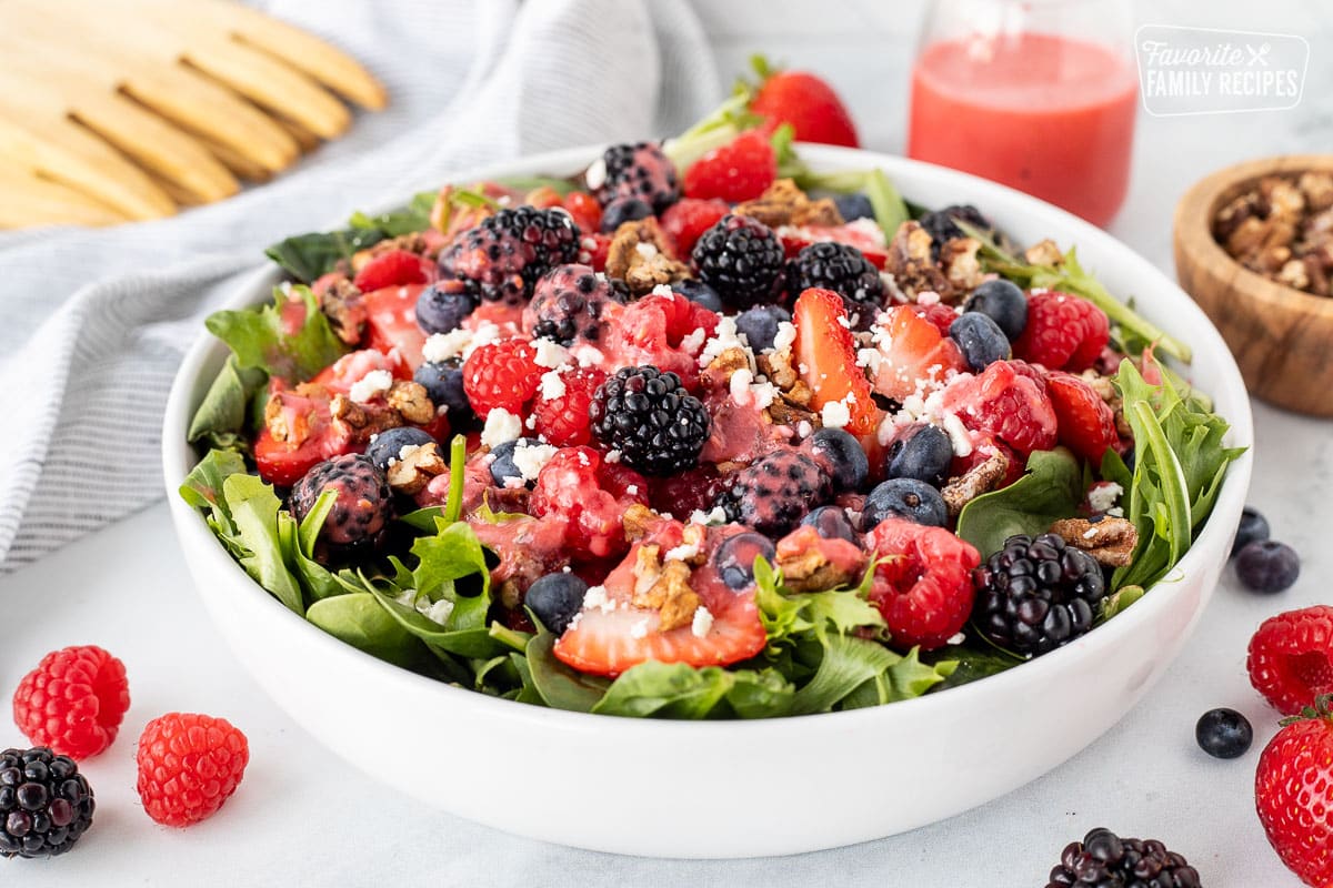 Bowl of Nuts About Berries Salad with dressing.