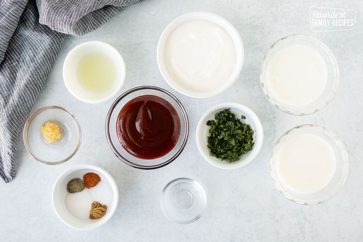 Ingredients to make Barbecue Chicken Salad dressing including mayo, buttermilk, milk, cilantro, barbecue sauce, lime juice, garlic, vinegar and spices.