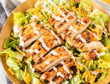 Salad bowl of Barbecue Chicken Salad with dressing.