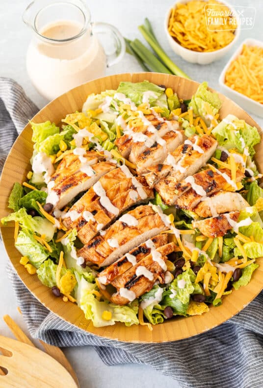 Salad bowl of Barbecue Chicken Salad with dressing.