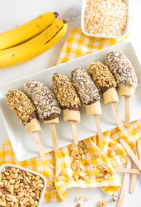 chocolate covered bananas on a plate