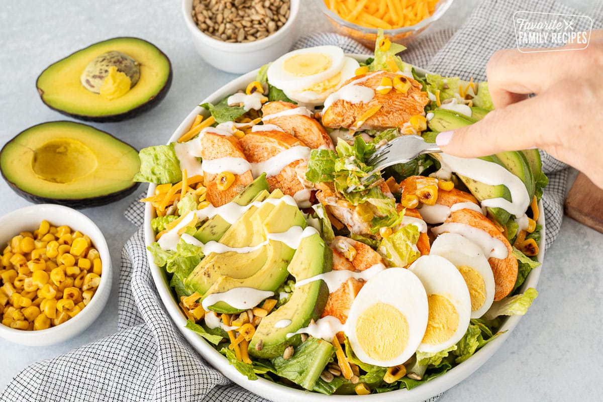 Fork poking into a bowl of Buffalo Chicken Salad.