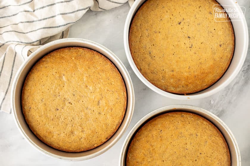 Three cake pans with baked Hummingbird cake.