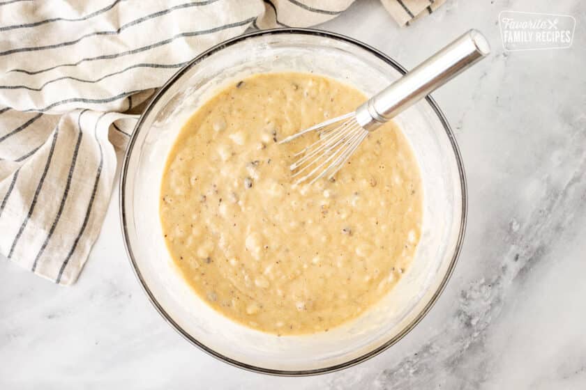 Glass mixing bowl with Hummingbird Cake batter.