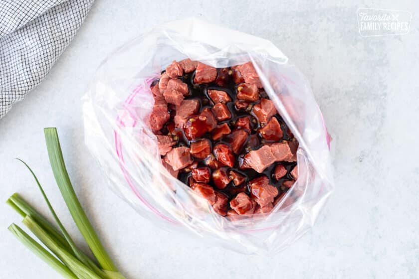 Ziplock bag with cut up steak and marinade.