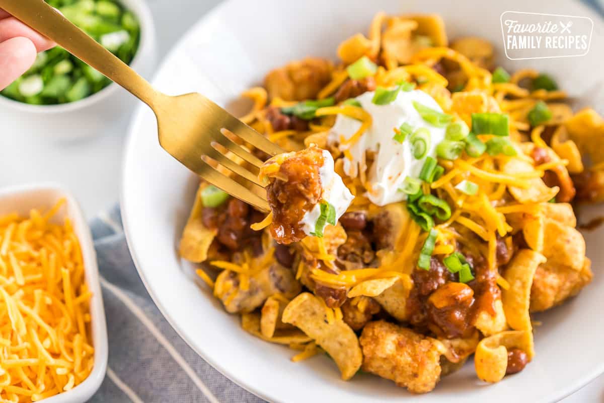 A fork taking a bite of Totchos