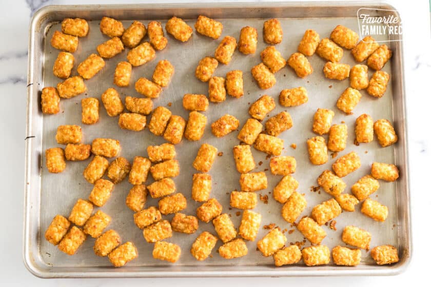 Tater tots cooked on a baking sheet