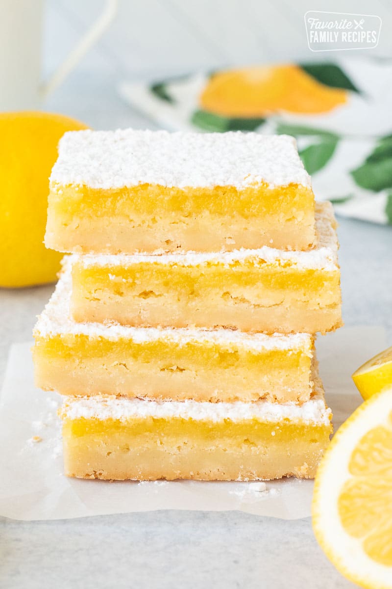 Four stacked Lemon Bars.