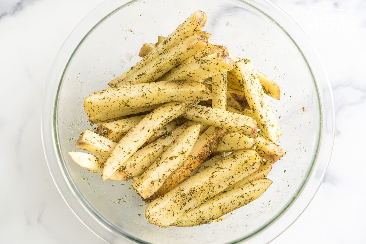 Cut and seasoned potatoes in a bowl