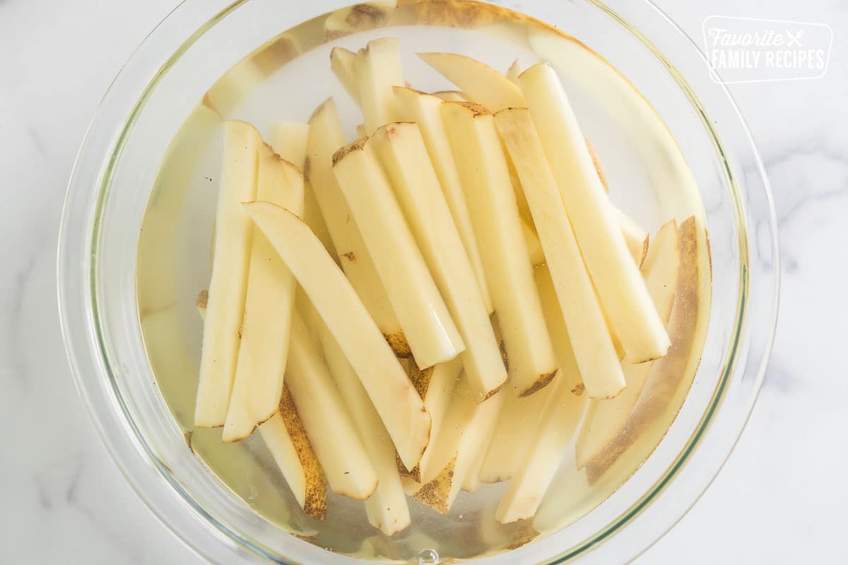 cut potatoes soaking in water