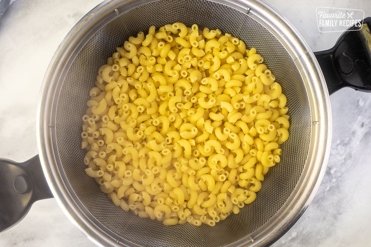 Cooked pasta in a colander.