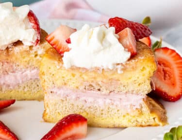 Cut in half slice of Strawberry French Toast on a plate.