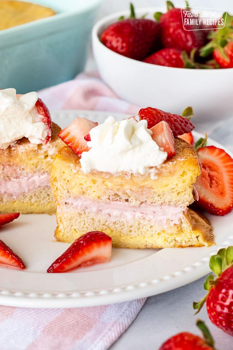 Cut in half slice of Strawberry French Toast on a plate.