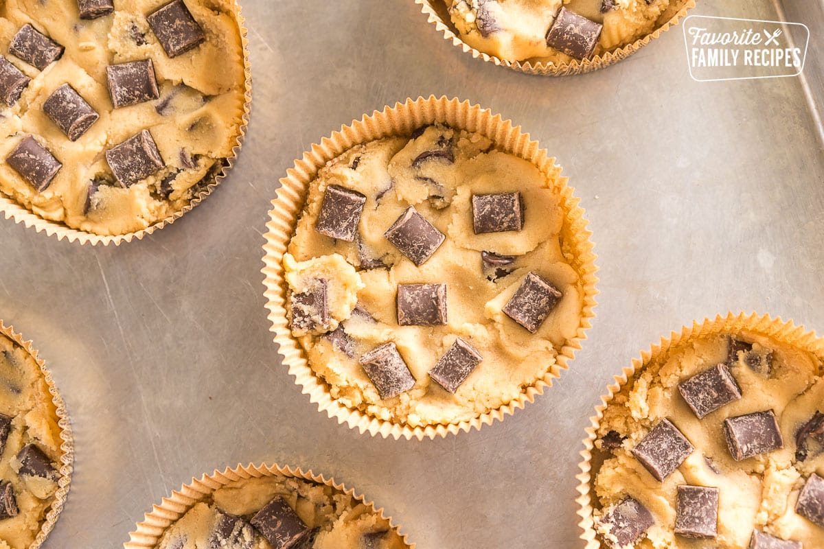 Dough with chocolate chunks in large baking cups