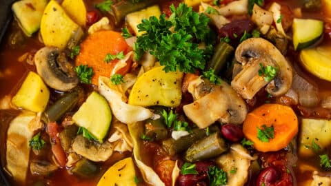 Bowl of Weight Loss Magic Soup garnished with parsley.