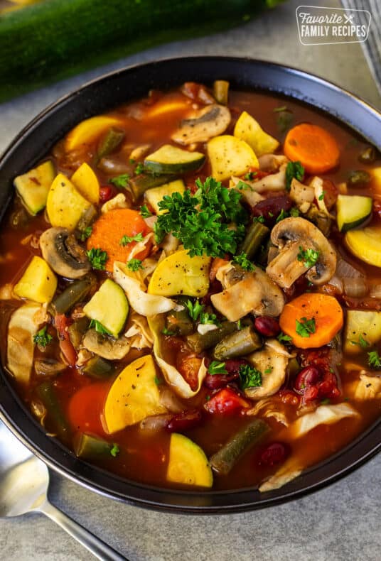 Bowl of Weight Loss Magic Soup garnished with parsley.