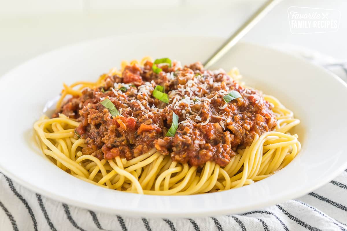 Meat Sauce on pasta topped with parmesan and basil